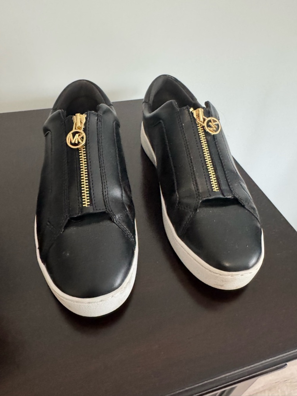 Michael Kors Black Leather Slip-On Sneakers with Gold Zipper Accents